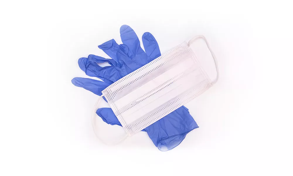 Photo of single use face mask and gloves.