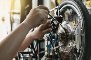 Someone repairing a bicycle.