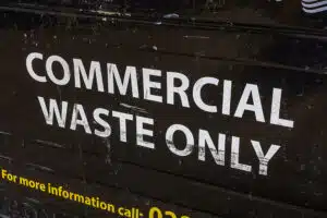Close up of a commercial waste bin with the words 'commercial waste only'