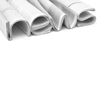 Newspapers folded up to make the word 'news'