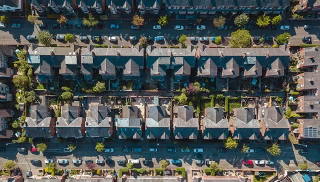 Streets of terraced houses pictured from above.