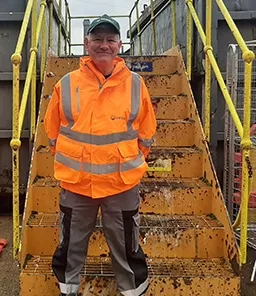 Member of site staff at on of the SLWP's Household Reuse and Recycling Centres.